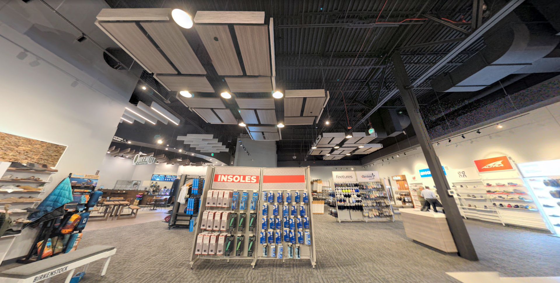 Altispace Ceiling Products Dardanos Shoes Store in Broomfield Ceiling Beams Slat Ceiling Wooden Illuminated Baffles Wooden Ceiling Clouds Wooden Baffles with Lighting Commercial Wood Beams