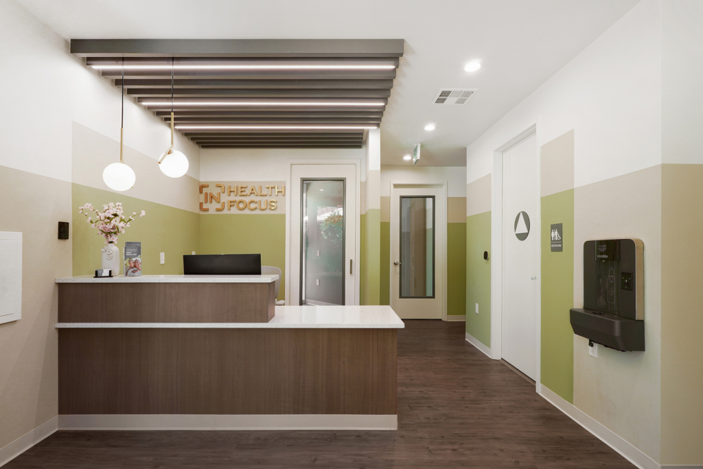 Modern Healthcare Reception Area Features Altispace Illuminated Beams, Acoustic Slat Wall Panels, Acoustic Slat Panels Cover